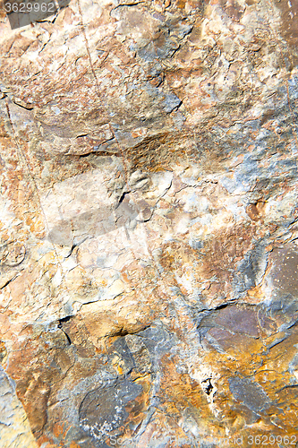 Image of rocks stone and red orange  the wall of morocco