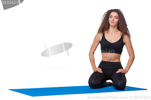 Image of Studio shot of a young fit woman after yoga exercises.