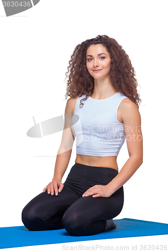 Image of Studio shot of a young fit woman after yoga exercises.
