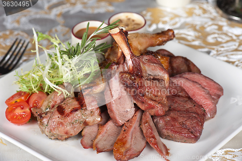 Image of grilled meat with herbs