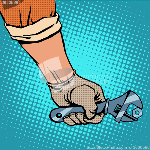 Image of Hand and working the wrench