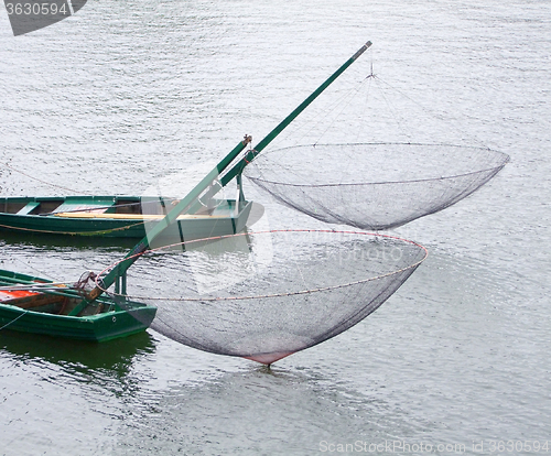 Image of boats with fishing nets