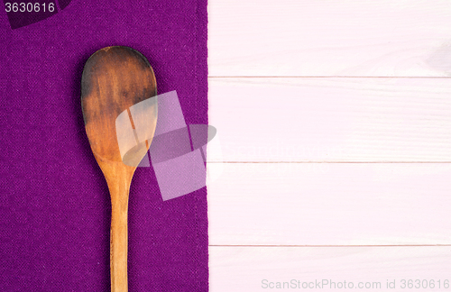 Image of Kitchenware on purple towel