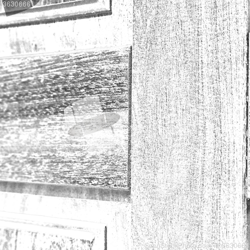 Image of abstract texture of a brown antique wooden old door in italy   e