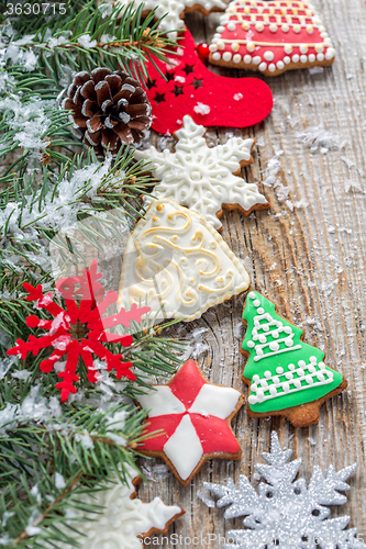 Image of Fir branches and Christmas decorations and gingerbread.