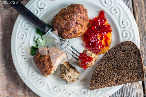 Image of Turkey cutlets with sweet pepper jam closeup.