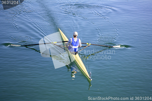 Image of Young man Rower in a boat