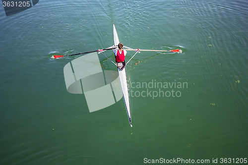 Image of Young man Rower in a boat