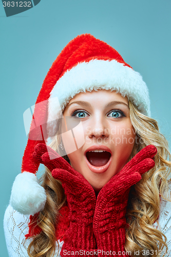 Image of portrait of girl dressed in santa hat 