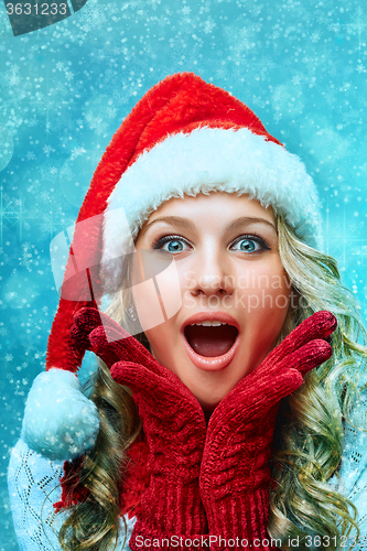 Image of portrait of girl dressed in santa hat 