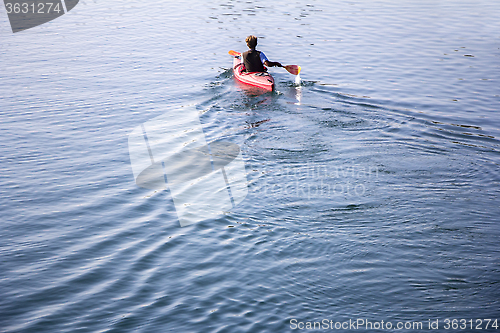 Image of Young man Rower in a boat