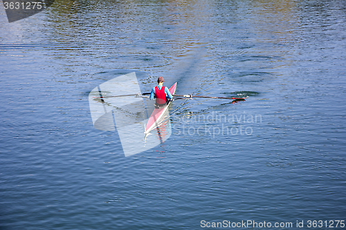 Image of Young man Rower in a boat