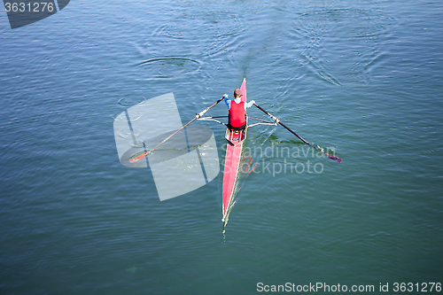 Image of Young man Rower in a boat