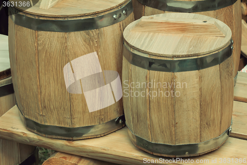 Image of Wooden oak barrels for storing wine.