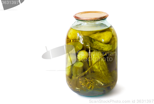 Image of Home canning: glass cylinders with pickled cucumbers  on white b