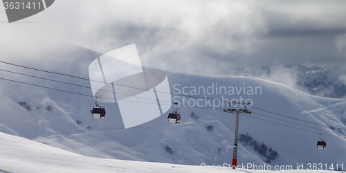 Image of Panoramic view on gondola lifts and off-piste slope in mist