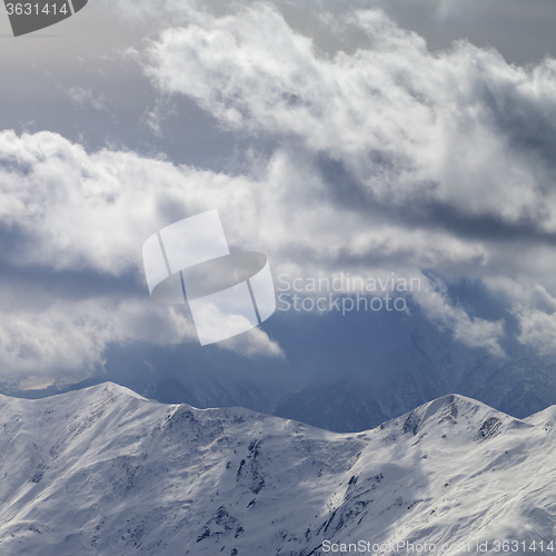 Image of Evening mountains and sunlight cloudy sky