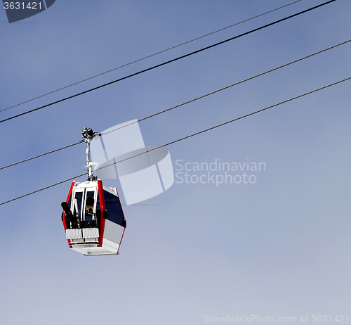Image of Gondola lift with ski and snowboards