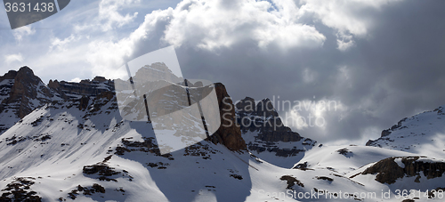 Image of Panoramic view on winter mountains in storm clouds