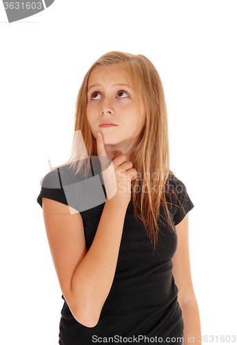 Image of Young girl holding finger on chin.