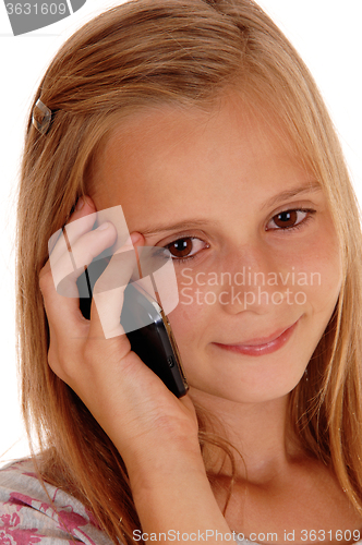 Image of Young girl talking on her cell phone.