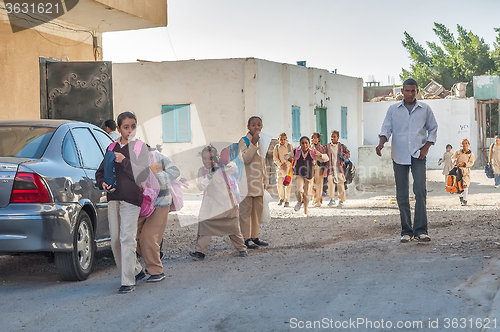 Image of Pupils come back home from school