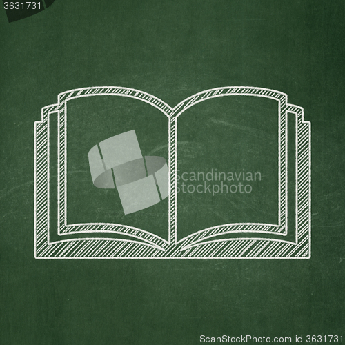 Image of Education concept: Book on chalkboard background