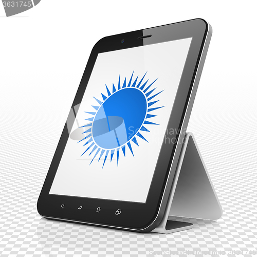 Image of Travel concept: Tablet Computer with Sun on display