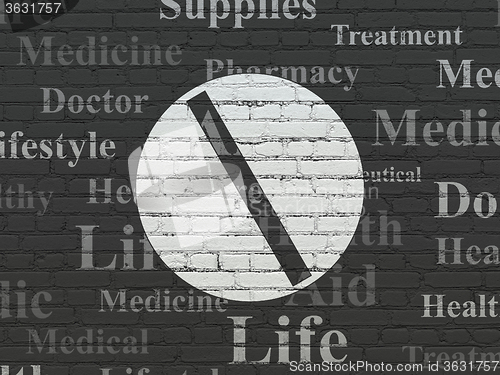 Image of Healthcare concept: Pill on wall background