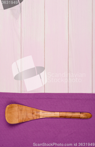 Image of Kitchenware on purple towel