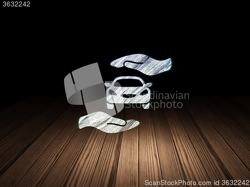 Image of Insurance concept: Car And Palm in grunge dark room