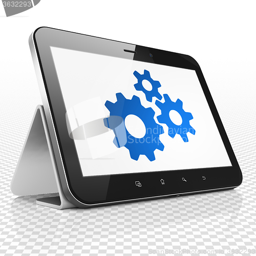 Image of Marketing concept: Tablet Computer with Gears on display