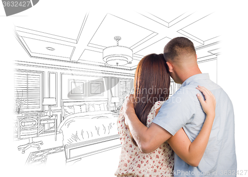 Image of Young Military Couple Looking Over Custom Bedroom Design Drawing