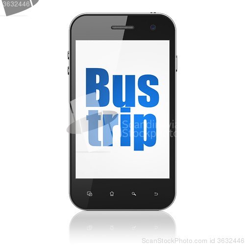 Image of Tourism concept: Smartphone with Bus Trip on display