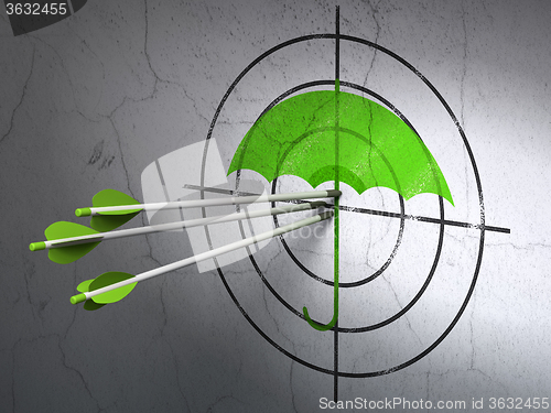Image of Security concept: arrows in Umbrella target on wall background