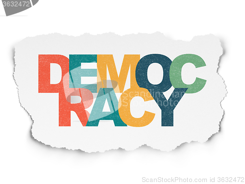 Image of Political concept: Democracy on Torn Paper background