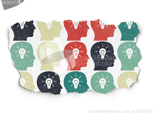 Image of Learning concept: Head With Light Bulb icons on Torn Paper background