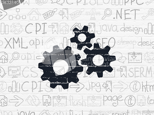 Image of Web development concept: Gears on wall background