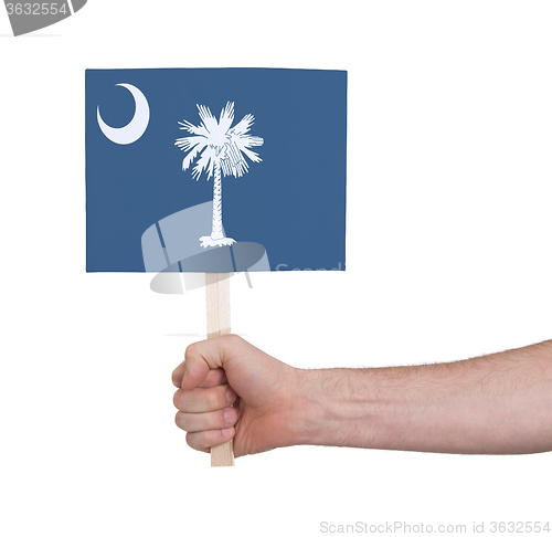 Image of Hand holding small card - Flag of Oklahoma