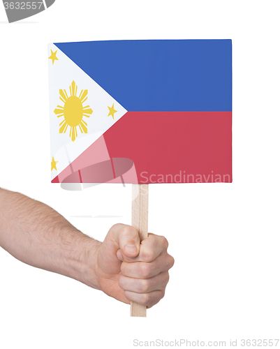 Image of Hand holding small card - Flag of Philipines