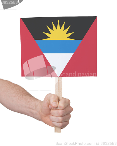 Image of Hand holding small card - Flag of Antigua and Barbuda