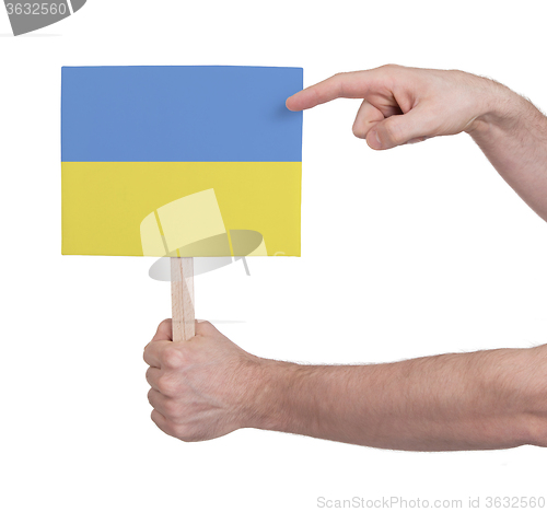 Image of Hand holding small card - Flag of Ukraine