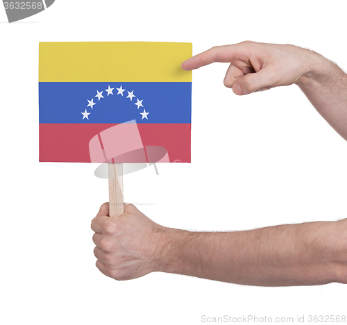 Image of Hand holding small card - Flag of Venezuela