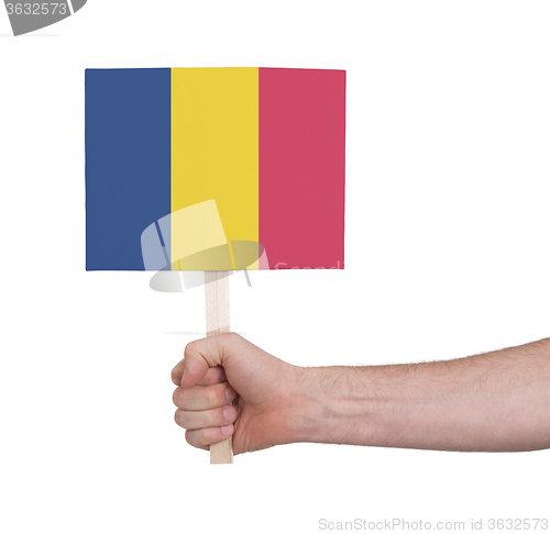 Image of Hand holding small card - Flag of Romania