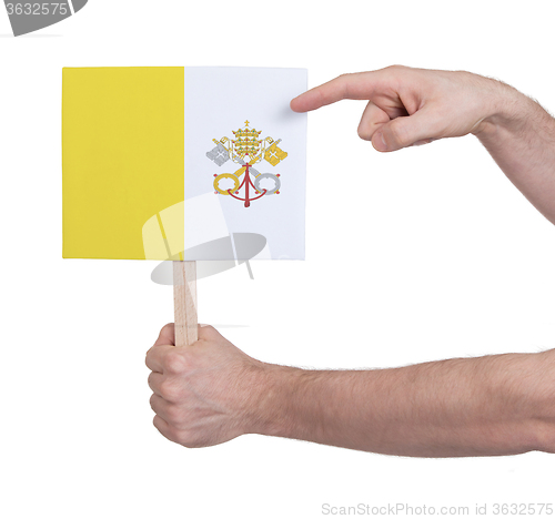 Image of Hand holding small card - Flag of Vatican City
