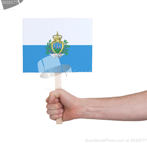 Image of Hand holding small card - Flag of San Marino
