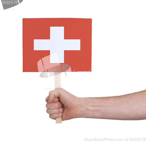 Image of Hand holding small card - Flag of Switzerland