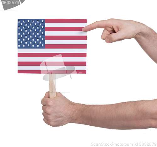 Image of Hand holding small card - Flag of the USA