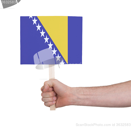 Image of Hand holding small card - Flag of Bosnia Herzegovina