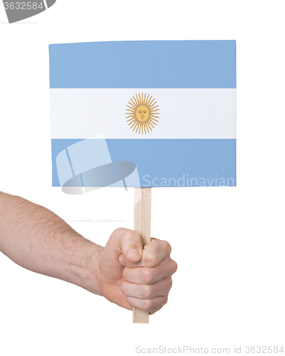 Image of Hand holding small card - Flag of Argentina